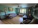 Cozy living room boasting hardwood floors, neutral paint, and a large bay window at 492 Pelenor Dr, Franklin, IN 46131