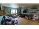 Comfortable living room with hardwood floors, a ceiling fan, and a classic grandfather clock at 492 Pelenor Dr, Franklin, IN 46131