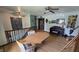 A cozy loft area with a table, piano, ceiling fan, and lots of natural lighting at 492 Pelenor Dr, Franklin, IN 46131