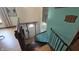 Hallway with wooden stairs leading to a door and a wall with decor at 492 Pelenor Dr, Franklin, IN 46131