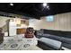 Basement area with a seating area and kitchenette setup, ideal for entertainment or relaxation at 497 Pebble Way, Greenwood, IN 46142