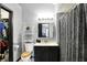 Cozy bathroom featuring a vanity, toilet, and shower with a view into an organized walk-in closet at 497 Pebble Way, Greenwood, IN 46142