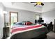 Comfortable bedroom with large windows and decorative tray ceiling at 497 Pebble Way, Greenwood, IN 46142