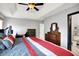 The bedroom includes a tray ceiling, carpeted floors, and access to a private bath at 497 Pebble Way, Greenwood, IN 46142