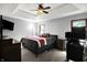 Bedroom featuring tray ceiling, windows, and carpeted floors at 497 Pebble Way, Greenwood, IN 46142