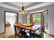 The dining room features a tray ceiling and scenic view at 497 Pebble Way, Greenwood, IN 46142