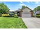 Charming single-Gathering home with manicured lawn, mature trees, and attached two car garage at 497 Pebble Way, Greenwood, IN 46142