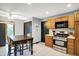 Eat-in kitchen features tile floors, dark accents, and stainless steel appliances at 497 Pebble Way, Greenwood, IN 46142