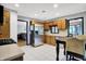 Bright eat-in kitchen with tile floors, stainless appliances, and view of living area at 497 Pebble Way, Greenwood, IN 46142