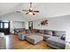 Expansive living room with fireplace, hardwood floors and neutral sectional sofa at 497 Pebble Way, Greenwood, IN 46142