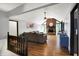 Open concept living room with vaulted ceilings, fireplace, hardwood floors and neutral paint at 497 Pebble Way, Greenwood, IN 46142
