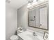 Clean bathroom featuring a large mirror, white vanity, and a neutral color scheme at 523 Torrey Ct, Avon, IN 46123