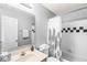 Well-lit bathroom featuring a shower/tub combo, vanity, and a toilet at 523 Torrey Ct, Avon, IN 46123