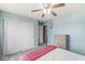 Bedroom with a ceiling fan, double door closet, and dresser against a wall at 523 Torrey Ct, Avon, IN 46123