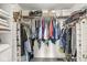 Walk-in closet with clothes hanging on rods and items stacked on shelves at 523 Torrey Ct, Avon, IN 46123