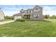 Well-maintained two-story home with brick and siding, an attached garage, and a green lawn at 523 Torrey Ct, Avon, IN 46123