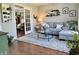 Cozy living room featuring a comfortable sectional sofa, a glass coffee table, and an inviting decor at 523 Torrey Ct, Avon, IN 46123