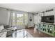 Bright living room with large windows, hardwood floors, and stylish decor at 523 Torrey Ct, Avon, IN 46123