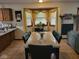Bright dining room featuring a marble table, seating for six, and natural light from a bay window at 6006 Buell Ln, Indianapolis, IN 46254