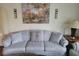 Comfortable living room featuring a plush sofa, decorative pillows, and a serene ambiance at 6006 Buell Ln, Indianapolis, IN 46254