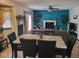 Cozy dining room connected to the living area, featuring a fireplace and comfortable seating at 6006 Buell Ln, Indianapolis, IN 46254
