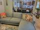 Inviting living room with comfortable seating, decorative pillows, and an open view to the dining area at 6006 Buell Ln, Indianapolis, IN 46254