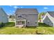 The backyard features a covered patio area and lush green lawn at 6305 Norwich Dr, Brownsburg, IN 46112