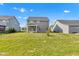 Backyard featuring a newly built lawn and grey siding of the house at 6305 Norwich Dr, Brownsburg, IN 46112