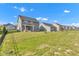 Backyard with houses in the background and lush green grass in the neighborhood at 6305 Norwich Dr, Brownsburg, IN 46112