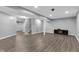 Large finished basement features recessed lights, wood-look floors, and ample open space at 6305 Norwich Dr, Brownsburg, IN 46112