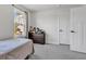 Bedroom featuring neutral walls, carpet, a window that lets in natural light and a dark wood dresser at 6305 Norwich Dr, Brownsburg, IN 46112