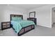 Cozy bedroom featuring a queen size bed with decor, dresser, and plush carpet flooring at 6305 Norwich Dr, Brownsburg, IN 46112