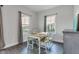 Bright dining room with hardwood floors, large windows, and contemporary decor at 6305 Norwich Dr, Brownsburg, IN 46112