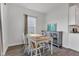 Dining room featuring a wooden table, seating for four, and stylish decor at 6305 Norwich Dr, Brownsburg, IN 46112