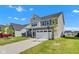 Beautiful two-story home with manicured lawn, a two car garage, and a long driveway at 6305 Norwich Dr, Brownsburg, IN 46112