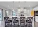 Modern kitchen with large quartz island, stylish pendant lighting, and stainless steel appliances at 6305 Norwich Dr, Brownsburg, IN 46112