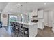 Bright, modern kitchen features a large island with seating, stainless steel appliances and ample counter space at 6305 Norwich Dr, Brownsburg, IN 46112
