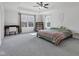 Spacious and bright main bedroom with tray ceiling, carpet, and a ceiling fan at 6305 Norwich Dr, Brownsburg, IN 46112