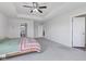 Bright main bedroom showing entrances to the main bathroom and walk-in closet at 6305 Norwich Dr, Brownsburg, IN 46112