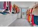 Spacious walk-in closet with ample hanging storage and a window for natural light at 6305 Norwich Dr, Brownsburg, IN 46112