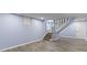 Finished basement with wood floors, staircase, and doorway to an adjacent room at 641 E 33Rd St, Indianapolis, IN 46205