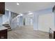 Basement featuring dark cabinets, gray countertop, vinyl flooring, white closets, and stairs leading up at 641 E 33Rd St, Indianapolis, IN 46205