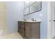 Bathroom featuring double sink vanity with modern fixtures and stylish mirrors at 641 E 33Rd St, Indianapolis, IN 46205