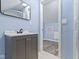 Bathroom featuring vanity with modern fixtures and partial view of a shower stall at 641 E 33Rd St, Indianapolis, IN 46205