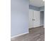 Neutral-toned bedroom with wood floors, white trim and white folding closet doors at 641 E 33Rd St, Indianapolis, IN 46205