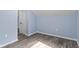 Bedroom with wood floors, blue walls, white trim and a white door ajar at 641 E 33Rd St, Indianapolis, IN 46205