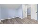 Bedroom with wood floors, blue walls, white trim and a white door ajar at 641 E 33Rd St, Indianapolis, IN 46205