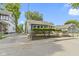 Street view of home featuring blue siding, white trim, and chain-link fence surrounding the property at 641 E 33Rd St, Indianapolis, IN 46205