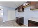 Kitchen featuring dark cabinets, gray countertop, vinyl flooring, and a white closet at 641 E 33Rd St, Indianapolis, IN 46205