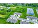 Aerial view of a new home community with a pond, green spaces and well-maintained townhomes at 6429 Yuma Ct, Whitestown, IN 46075